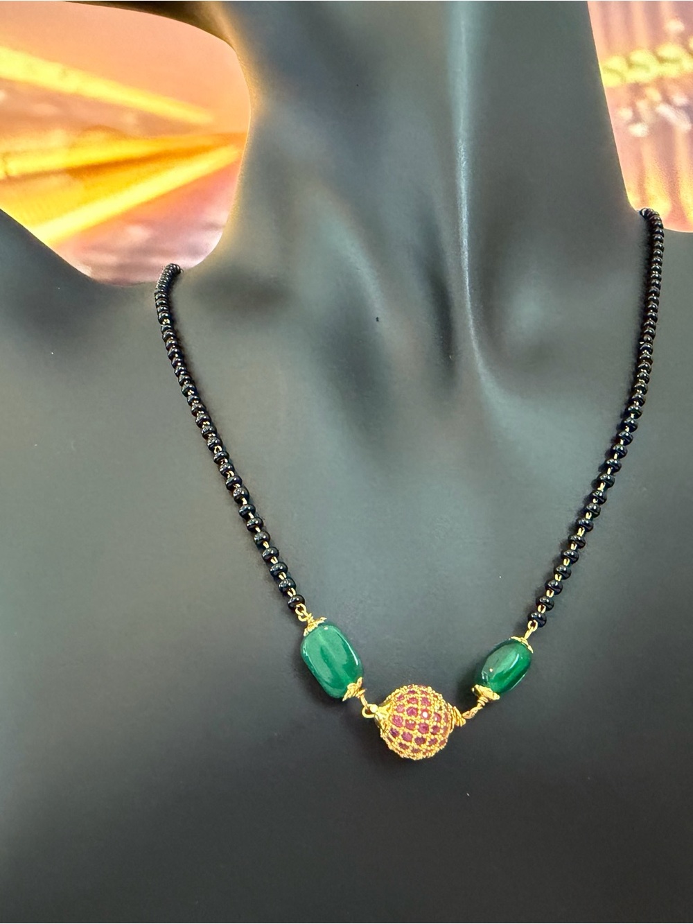 Gold-Tone Black Bead Necklace with Green Gemstones and Pink Pave Accent